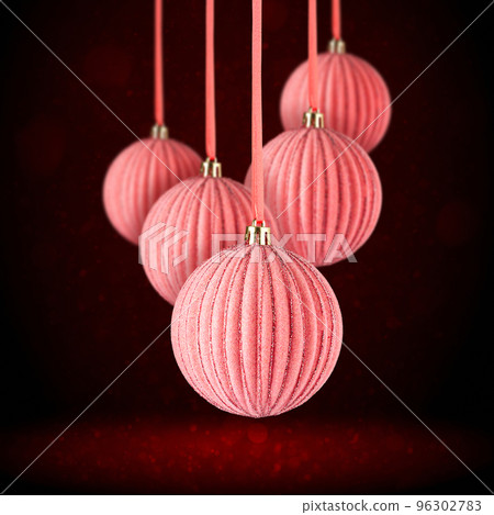Christmas tree ornaments hanging. Balls made of glass or plastic hanging over abstract background Christmas tree ornaments hanging. Balls made of glass or plastic hanging over abstract background 96302783