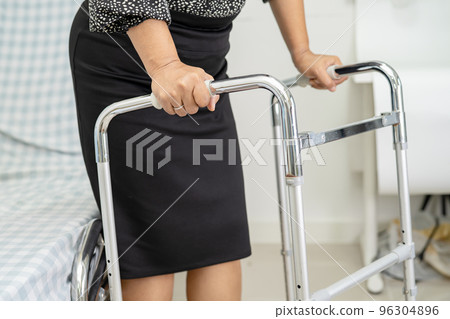 Asian lady patient pain her back wrist orthopedic lumbar with walker. Asian lady patient pain her back wrist orthopedic lumbar with walker. 96304896