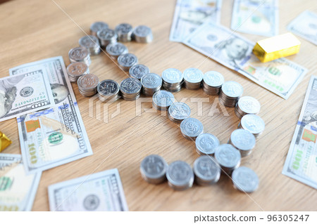 Gold bars, dollar banknotes and dollar sign shaped stacks of coins on table. Gold bars, dollar banknotes and dollar sign shaped stacks of coins on table. 96305247