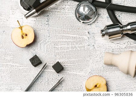 Parts of hookah and fruits on wooden background Parts of hookah and fruits on wooden background 96305836