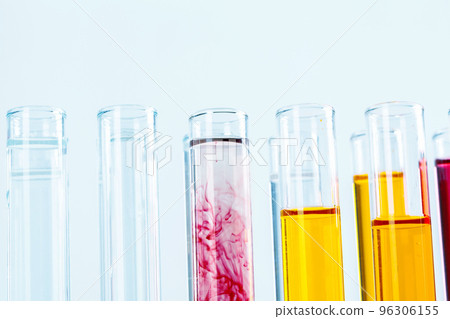 Different laboratory glassware with colored liquids close up Different laboratory glassware with colored liquids close up 96306155