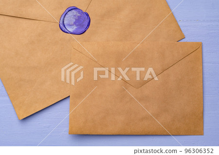 Letter envelope on lavender wooden background, copy space Letter envelope on lavender wooden background, copy space 96306352