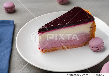 Piece of blueberry cheesecake on a white plate Piece of blueberry cheesecake on a white plate 96306578