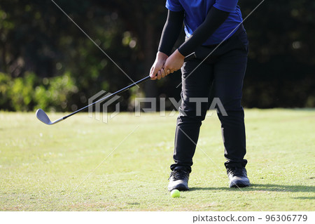 Young male golfer player on golf course 96306779
