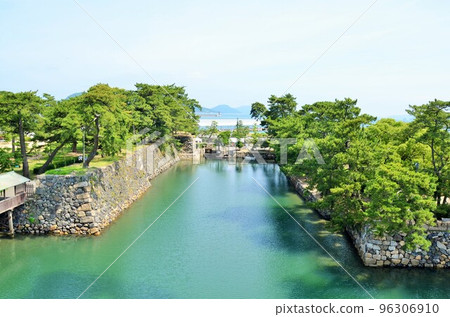 Takamatsu Castle The stone walls and moat of the second and third enclosures seen from the castle tower 96306910