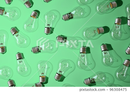 Close-up of an incandescent lamp on green background. 96308475
