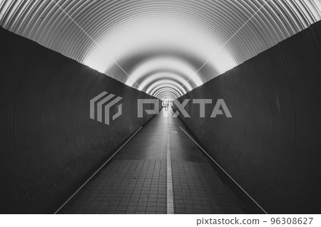 People in pedestrian Brunkenberg Tunnel in Stockholm, Sweden. Black and white image. 96308627
