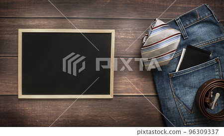 Men's necktie and accessories on Brown background with chalkboard with place for text. Men's necktie and accessories on Brown background with chalkboard with place for text. 96309337