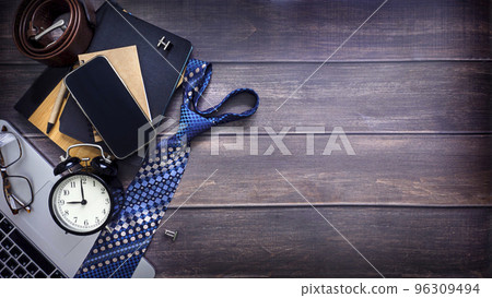 Men's necktie and notebook wallet smartphone cufflinks glasses alarm clock 9 am pen. Heart shaped necktie with copy space Flat lay, top view. Valentine's day Father's day, Boss day, Men's necktie and notebook wallet smartphone cufflinks glasses alarm clock 9 am pen. Heart shaped necktie with copy space Flat lay, top view. Valentine's day Father's day, Boss day, 96309494