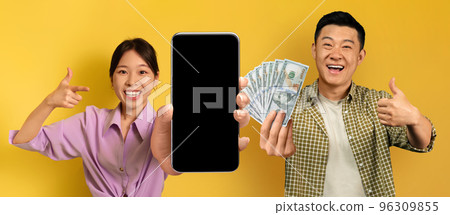 Smiling black asian enjoying victory on yellow, gambling online, mockup Smiling black asian enjoying victory on yellow, gambling online, mockup 96309855
