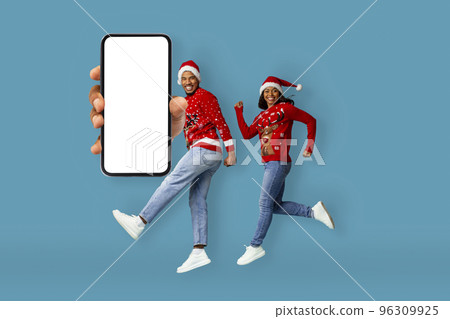 Excited african american couple running to catch winter sale, mockup 96309925