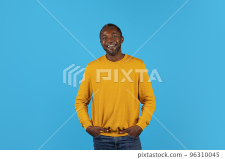 Cool mature black man with hands in his pockets Cool mature black man with hands in his pockets 96310045