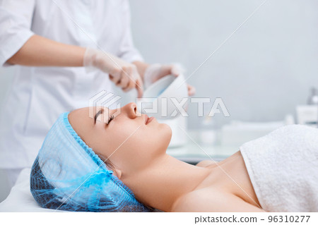 beautiful young woman patient with professional cosmetologist 96310277