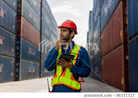 Foreman man working checking at Container cargo harbor to loading containers. 96311315