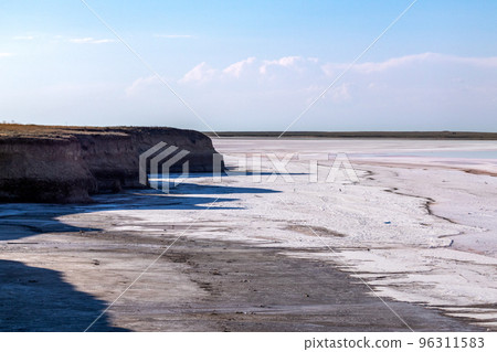 Salt lake surface with healing dirt, pastel sky Salt lake surface with healing dirt, pastel sky 96311583