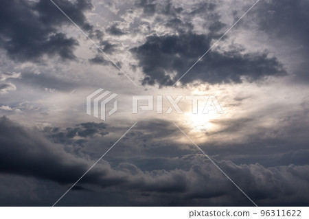 Grey epic clouds with sun sunlight on stormy sky Grey epic clouds with sun sunlight on stormy sky 96311622
