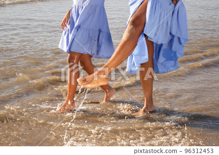 Close-up of woman and child bare feet Close-up of woman and child bare feet 96312453