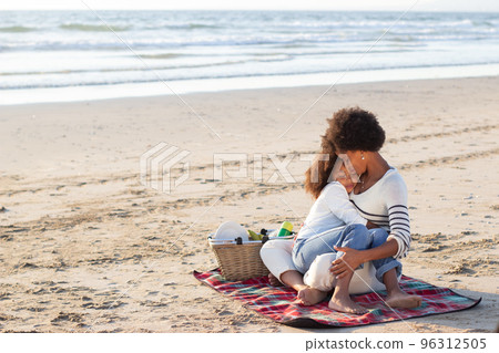 Tender African American family on picnic on beach 96312505