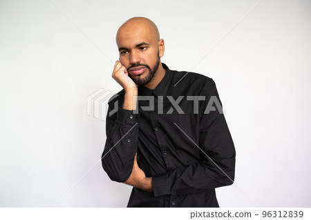 Portrait of sad young man leaning on hand Portrait of sad young man leaning on hand 96312839