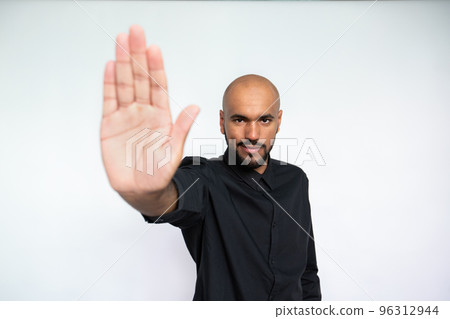 Portrait of confident young businessman making denial gesture 96312944