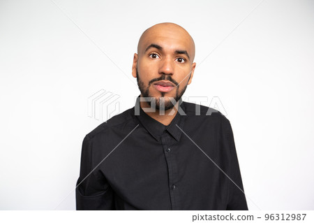 Portrait of surprised young businessman staring at camera 96312987