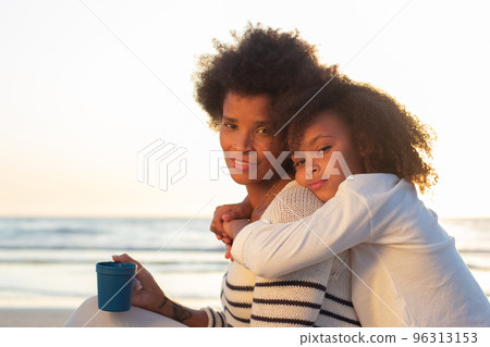 Portrait of satisfied family at sunset 96313153