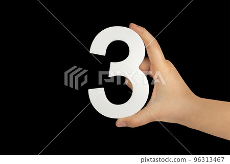 number three in hand isolated on black background. Number three in a child's hand on a black background. To be inserted into a project or design. number three in hand isolated on black background. Number three in a child's hand on a black background. To be inserted into a project or design. 96313467