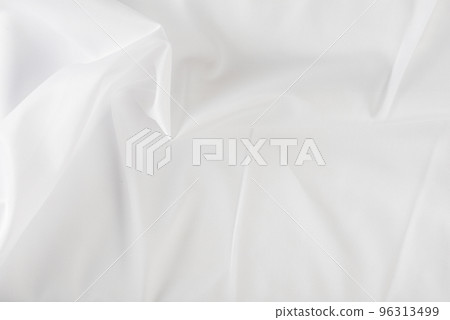 White wrinkled fabric. White fabric with large folds top view. For overlay texture or design. 96313499
