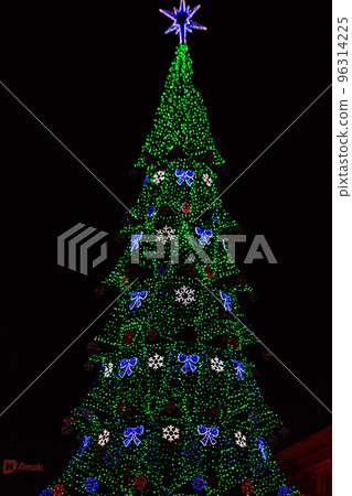 Decorated Christmas tree with multi-colored lights at night Decorated Christmas tree with multi-colored lights at night 96314225
