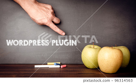 Text WORDPRESS PLUGIN on a dark blackboard. Apples on a wooden table Text WORDPRESS PLUGIN on a dark blackboard. Apples on a wooden table 96314563