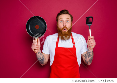 wondered chef with beard and red apron is ready to cook 96314620