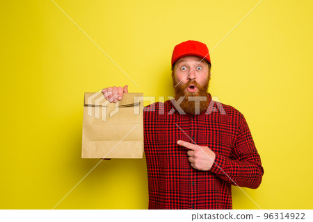 Amazed delivery man with hat and beard 96314922