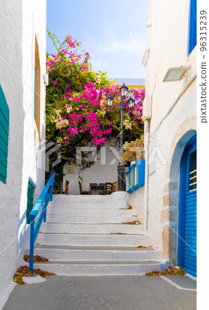 One of the cozy streets of Plaka town. Milos island, Greece 96315239