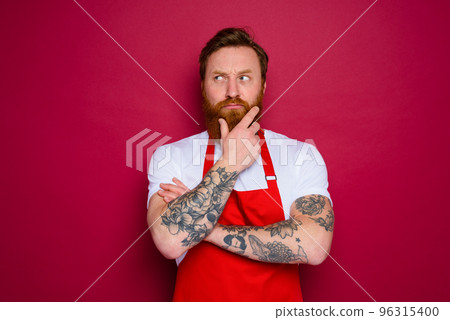 doubter isolated chef with beard and red apron 96315400