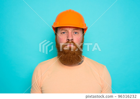 Worker with yellow hat is confused about his work 96316232