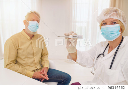 doctor is misuring the temperature of the patient doctor is misuring the temperature of the patient 96316662