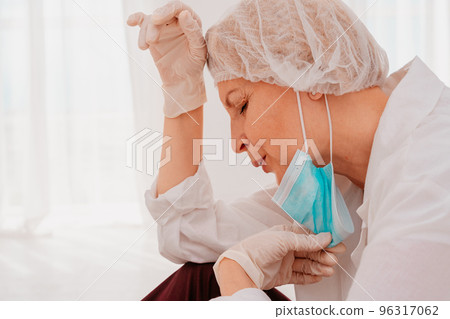doctor is tired and stressed due to covid-19 virus pandemic 96317062