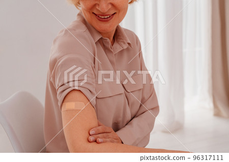 Patient with patch on the arm did the covid-19 vaccine 96317111