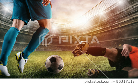 Close up of a football action scene with competing soccer players at the stadium 96317112