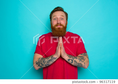 Man with beard asks to be forgiven and prays Man with beard asks to be forgiven and prays 96317119