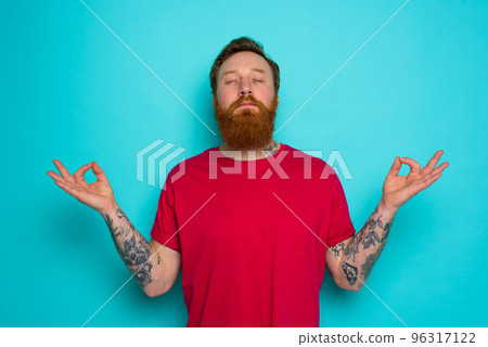 Man is total relax in yoga position 96317122