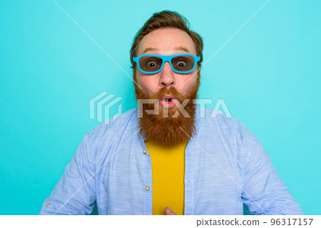 Man with beard and sunglasses is wondered and happy Man with beard and sunglasses is wondered and happy 96317157