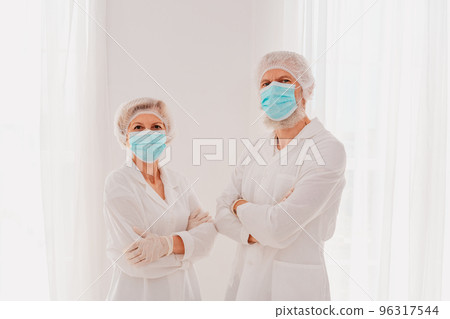 doctors with mask and face protector are ready to work in hospital doctors with mask and face protector are ready to work in hospital 96317544
