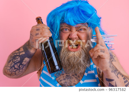 Fat man with beard and wig smokes cigarettes and drinks beer Fat man with beard and wig smokes cigarettes and drinks beer 96317582