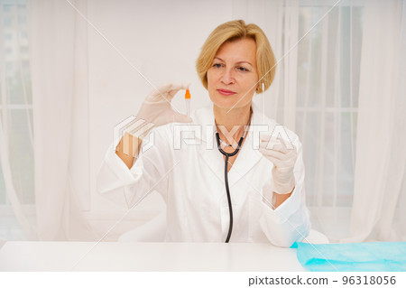 Doctor is checking the covid 19 with a tester Doctor is checking the covid 19 with a tester 96318056