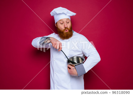 surprised chef with beard and red apron is ready to cook 96318090
