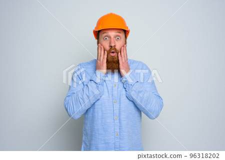 Isolated amazed architect with beard and orange helmet 96318202