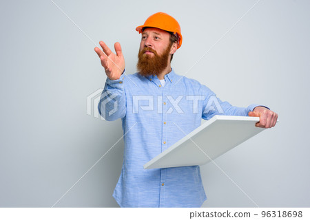 Confidant architect with beard and orange helmet does a sketch 96318698