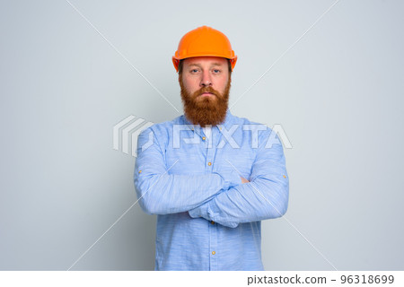 Isolated confidant architect with beard and orange helmet 96318699