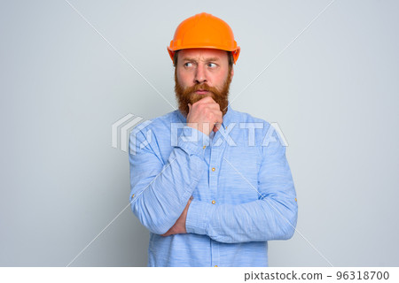 Isolated doubter architect with beard and orange helmet Isolated doubter architect with beard and orange helmet 96318700